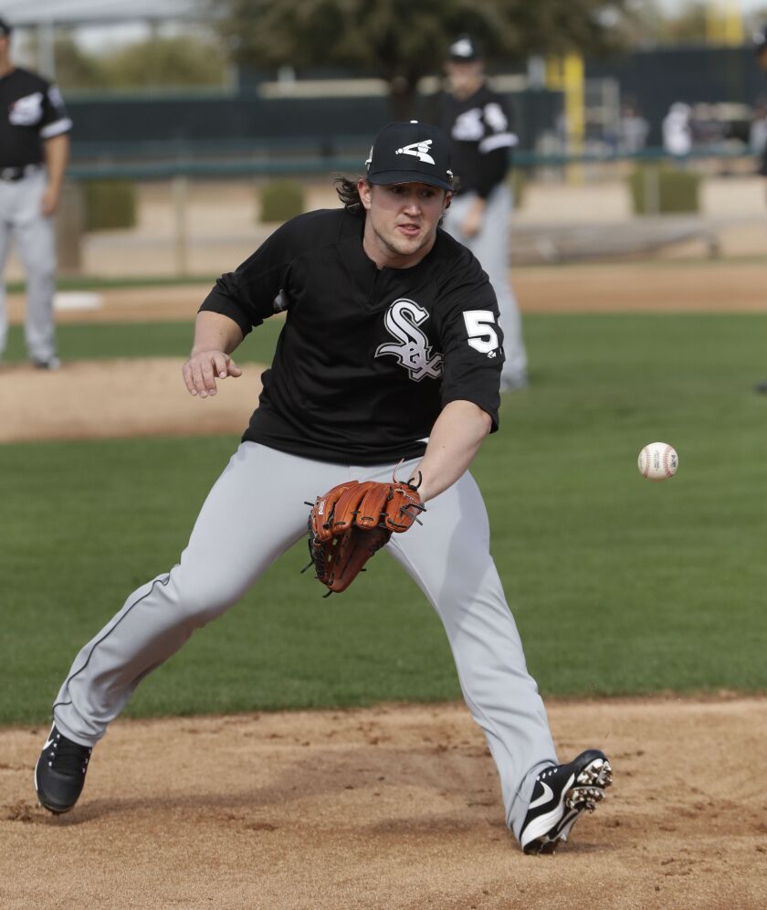 <em>Carson Fulmer covers first during pitchers’ fielding practice.<br></em>